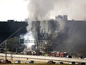 Smoke billows from a seven-story building after a small private plane crashed into the building in Austin, Texas, on Thursday.