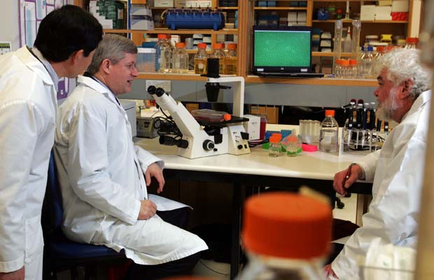 Prime Minister Stephen Harper visited Canada's National Microbiology Laboratory last year. Health Canada documents obtained through an access-to-information request reveal close to 250 internal incidents — ranging from equipment failures to potential chemical exposures — were reported in the lab between 2005 and 2009. Also pictured are (right) Dr. Frank Plummer, Scientific Director General and Dr. Yan Li (left), Chief of the Influenza and Respiratory Viruses Section which was doing research on the H1N1 flu virus at the time.