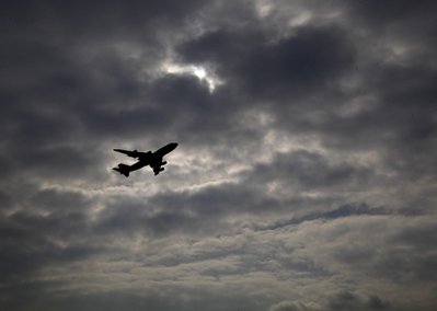 An aircraft is seen after take off at the airport ...