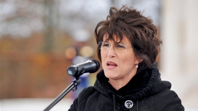 In this Nov. 11, 2010, photo released by the U.S. Air Force, then-U.S. Ambassador to Luxembourg Cynthia Stroum speaks to a crowd at the Luxembourg American Cemetery and Memorial.