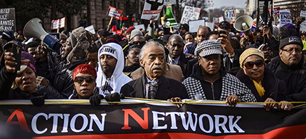 Al Sharpton (center) leads a march with family members of Eric Garner, Michael Brown, Tamir Rice and Trayvon Martin to Capitol Hill in a protest against police violence. (photo: James Lawler Duggan/Reuters)