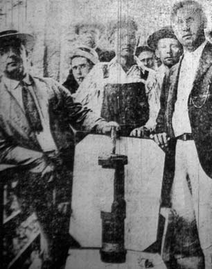 UMW officials and members of the miners army display a bomb dropped on them during the Battle of Blair Mountain, December, 1921.