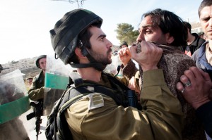 IDF soldier threatening a Palestinian activist for saying "I exist!"