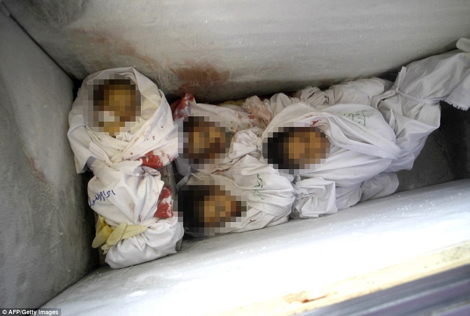 No more room: Babies' bodies have been crammed into an ice cream freezer in Rafah's morgue, which ran out of room for bodies today amid an infrastructure crisis