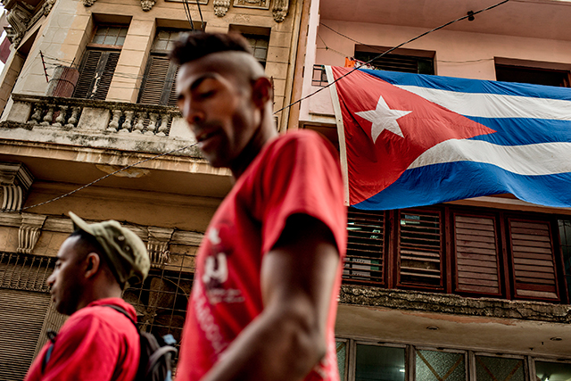A Cuban flag flies over a street in Havana, Dec. 19, 2014. President Barack Obamas restoration of diplomatic ties with Cuba this week has snatched a major cudgel from his critics and potentially restored some of Washingtons influence in Latin America. (The New York Times)