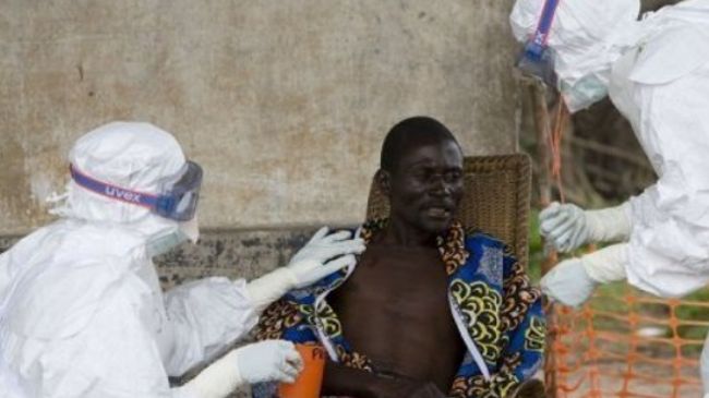 File photo shows nurses taking care of an African patient with Ebola hemorrhagic fever.