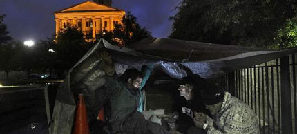 Alton Hardwick, Charles Potter and Robert Shelton try to keep dry at Legislative Plaza, which has served as a campsite for Occupy Nashville. (Photo: John Partipilo / The Tennessean)