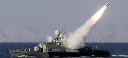 An Iranian navy vessel fires a Mehrab missile during the 'Velayat-90' naval war games in the Strait of Hormuz off southern Iran, 01/01/12. (photo: Ebrahim Noroozi/Getty Images)