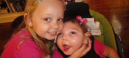 Elyse Linzey, 4, of Ridley Township, PA, with her sister Anabelle, 19 months, who requires constant care. Like many in recent months, Annabelle's parents learned she is no longer covered by Medicaid, 0/17/12. (photo: Linzey Family/Philly.com)