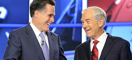 Republican presidential candidates Mitt Romney and Ron Paul shake hands before the start of the first 2012 Republican presidential debate in Manchester, New Hampshire, June 13, 2011. (photo: Getty Images)