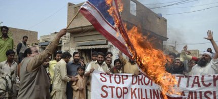 Pakistani men demonstrate against U.S. drone attacks. (photo: SS Mirza/AFP/Getty Images)