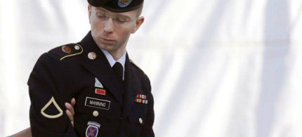 Army Pfc. Bradley Manning is escorted into a courthouse in Fort Meade, Md., on the third day of his court martial, 06/15/13. (photo: Patrick Semansky/AP)