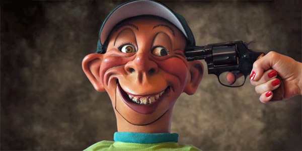 Jeff Dunham's puppet, Bubba J., gets a gun to his head as he attempts to reveal he's voting for Trump (Photo: Screenshot/YouTube)