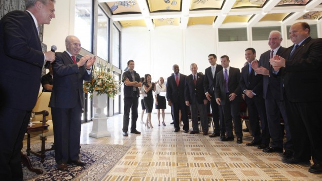 A Congressional delegation singing happy birthday to president Shimon Peres. (photo credit: Miriam Alster/Flash90)