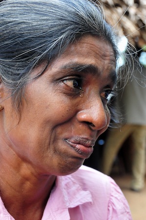 Kugamathi Kulasekeran, from the village of Allankulam in northern Sri Lanka, is taking care of three boys, while looking for one missing child. Her husband went missing during the war. Credit: Amantha Perera/IPS