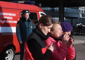 Tragdy and tears at St. Petersburg Airport. Photo courtesy of Tass, Sergey Konkov.