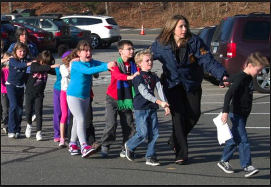 Teacher leading students away from Sandy Hook