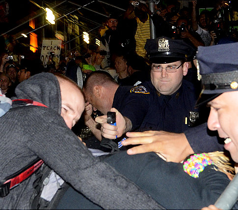 Protestors from an anti-Wall Street march are arrested and pepper sprayed as they tried to march to Wall Street Wednesday night.