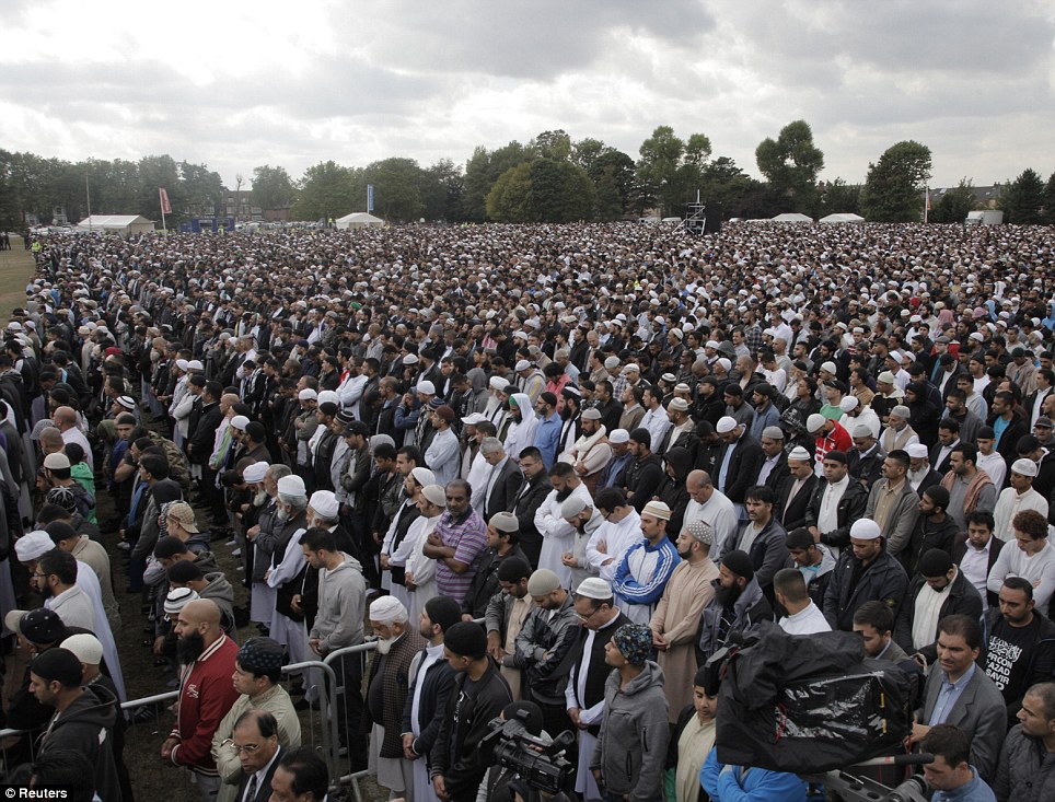 Prayers are held at Birmingham's Summerfield Park ahead of the funeral for Haroon Jahan, Shazad Ali and Abdul Musavir, all British Pakistanis, who were killed in the early hours last Wednesday during a wave of disorder and looting