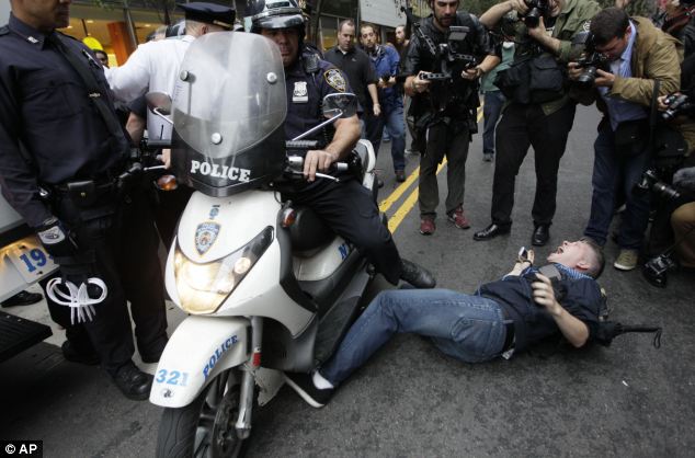 Heavy handed? Police have been accused of brutality after footage has emerged showing officers mowing down protesters on their motorbikes