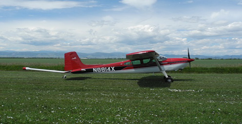 This airplane is a Cessna-180, specially modified for low-altitude geophysical surveys. The aircraft is owned and operated by Cloudstreet Flying Services, Fort Collins, Colo., working jointly with EDCON-PRJ of Lakewood, Colo. EDCON-PRJ is under contract to the USGS to obtain measurements of the earths magnetic field close to the ground.  The magnetic sensor (magnetometer) is located at the tip of the "stinger" attached to the rear of the airplane.  The magnetometer emits no energy or signal of its own. 