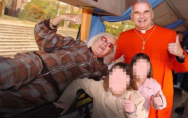 Friends: Jimmy Savile, left, and Cardinal Keith O'Brien were pictured together in Edinburgh in 2007 as the pair unveiled a 375,000 vehicle for the disabled