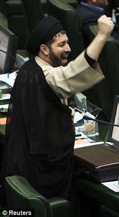 Chants: An Iranian MP shakes his first and shouts 'Death to England' during the parliamentary session which saw a vote to cue back ties with Britain
