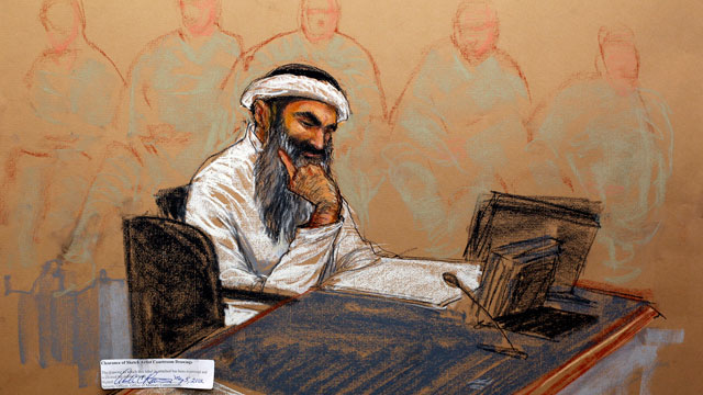 In this photo of a sketch by courtroom artist Janet Hamlin and reviewed by the U.S. Department of Defense, Khalid Sheikh Mohammed reads a document during his military hearing at the Guantanamo Bay U.S. Naval Base in Cuba, Saturday, May 5, 2012.