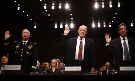 U.S. National Security Agency Director General Keith Alexander (L), Director of National Intelligence James Clapper and Deputy Attorney General James Cole (R) are sworn in to testify at a Senate Intelligence Committee hearing the Foreign Intelligence Surveillance Act legislation on Capitol Hill in Washington, September 26, 2013.