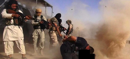 An image made available by the Jihadist Twitter account al-Baraka news on June 16, 2014 allegedly shows ISIS militants executing members of the Iraqi forces on the Iraqi-Syrian border. (photo: AFP)