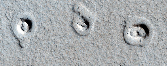 These unusual shapes on Mars surface are actually cones and inflated lava flows, Credit: NASA/JPL/University of Arizona. 