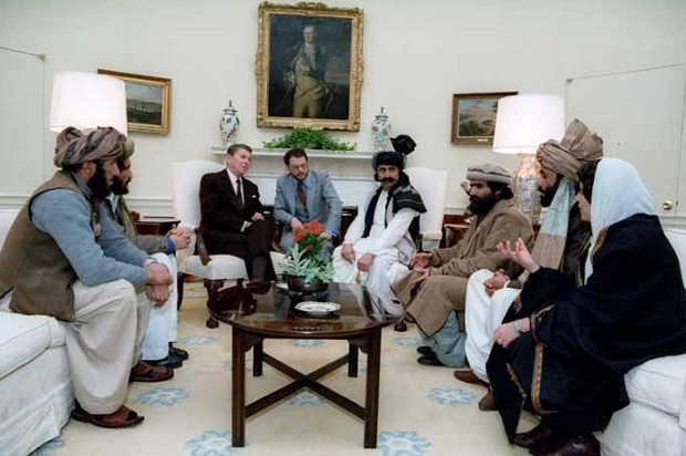 President Reagan meeting with the Afghan Mujahideen in the Oval Office in 1983 (Credit: U.S. government)