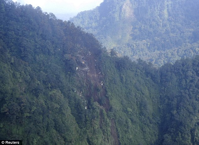 Remnants: A view of the wreckage of the Russian Sukhoi Superjet 100 aircraft in Mount Salak, West Java province, as seen from an Indonesia Airforce Super Puma helicopter on May 10