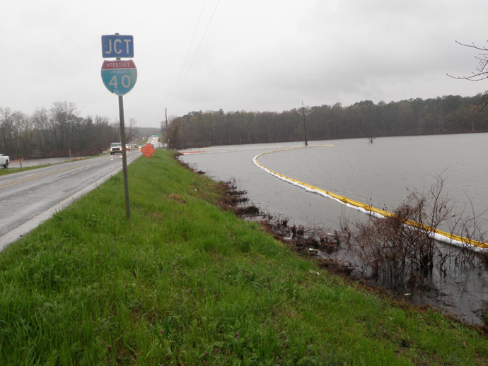 Containment boom is installed in Lake Conway following oil spill from Exxon pipeline rupture in Mayflower, Arkansas in this April 2, 2013 photo released to Reuters on April 11, 2013. (Reuters)