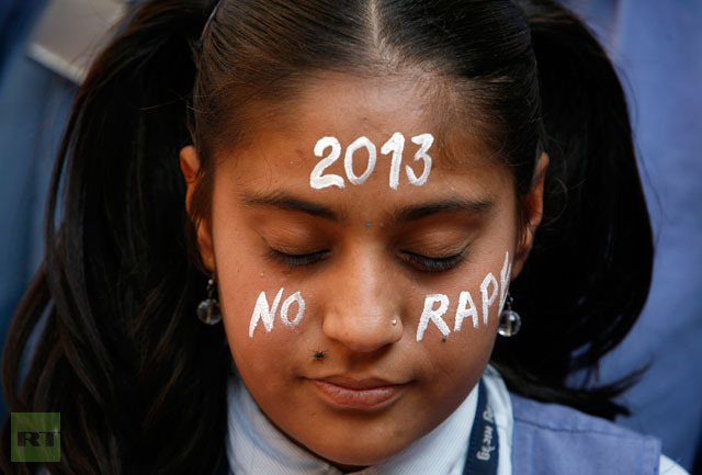 A student prays during a vigil for a gang rape victim, who was assaulted in New Delhi, in Ahmedabad.(Reuters / Amit Dave)