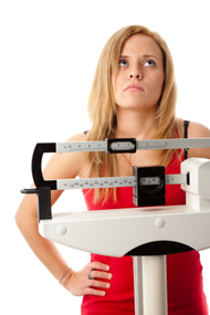 Woman Standing On The Scale Frustrated