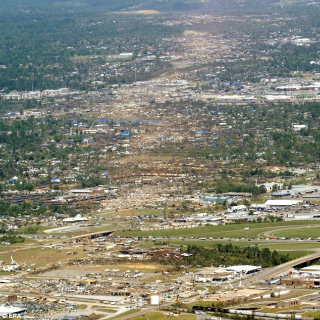 Fury from the air: More than 100 tornadoes cut a swathe of death and destruction through areas like Tuscaloosa in Alabama on April 29. The clean-up and rebuilding operations will last years and cost many millions